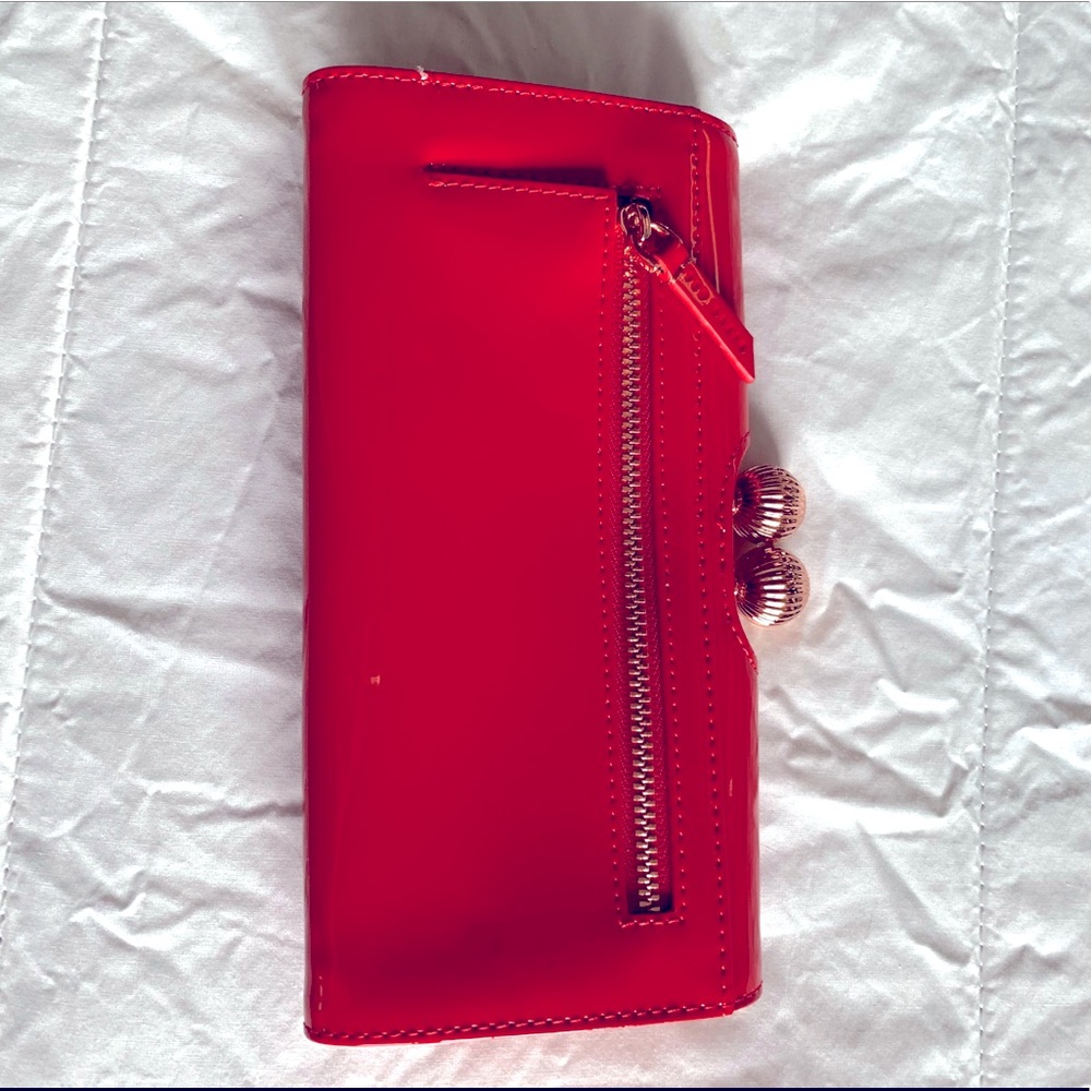 Tom Baker London clutch or wallet.